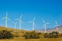 Wind turbine farm spread over valley and hills